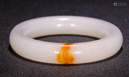 A HETIAN JADE CARVED BANGLE