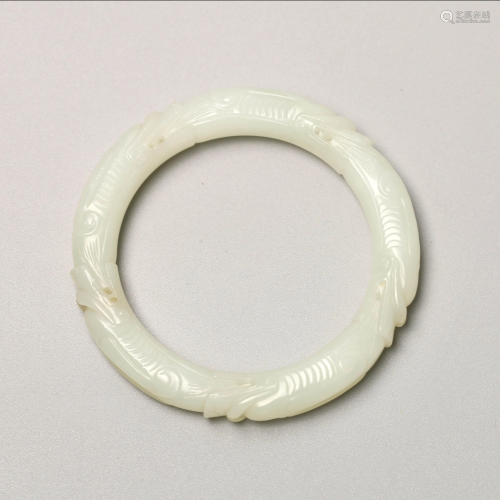 A Chinese Dragon Carved White Jade Bracelet