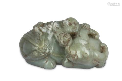 A CHINESE PALE CELADON JADE 'BOY AND BUFFALO CARVING.