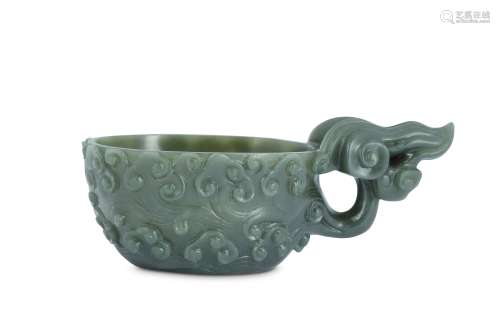 A CHINESE SPINACH-GREEN JADE ARCHAISTIC POURING VESSEL.