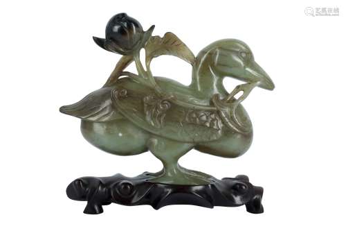 A CHINESE CELADON JADE 'DUCK' CARVING.