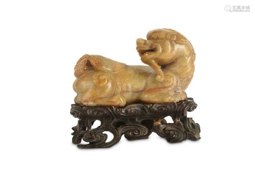 A CHINESE SOAPSTONE CARVING OF BIXIE.