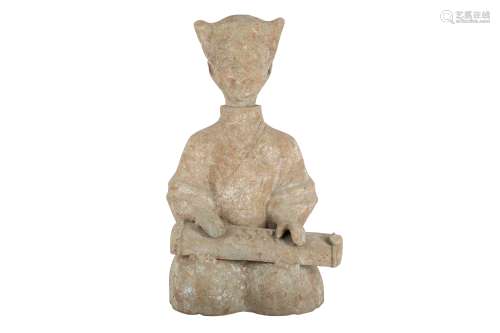A CHINESE POTTERY FIGURE OF A SEATED MUSICIAN.