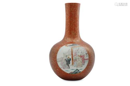 A CHINESE FAMILLE ROSE CORAL-GROUND BOTTLE VASE.