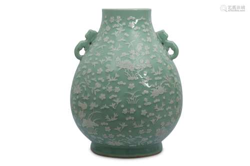 A LARGE CHINESE SLIP-DECORATED CELADON VASE, HU.