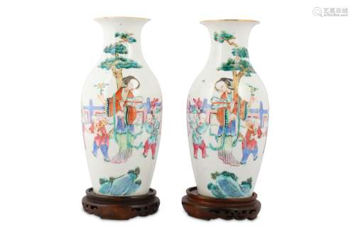 A PAIR OF CHINESE FAMILLE ROSE 'LADY AND BOYS' VASES.