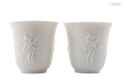 A PAIR OF CHINESE BLANC-DE-CHINE 'PRUNUS' CUPS.