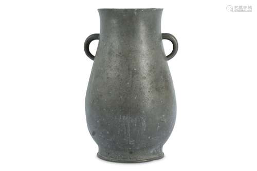 A PEWTER VASE.