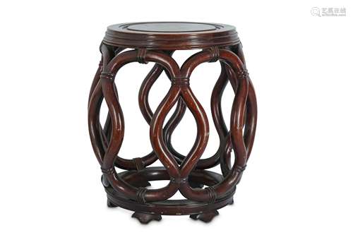 A CHINESE WOOD BARREL-SHAPED STOOL.