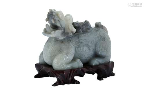 A CHINESE GREY JADE CARVING OF A QILIN.