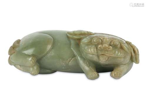 A CHINESE PALE CELADON JADE CARVING OF A LION DOG.