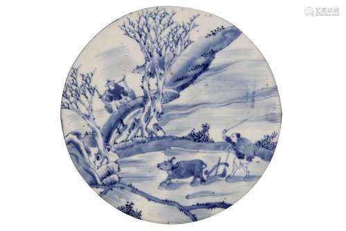 A CHINESE BLUE AND WHITE CIRCULAR 'PLOUGHMAN' PANEL.