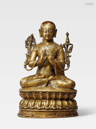 A SILVER AND COPPER INLAID BRASS FIGURE OF THE SEVENTH SAKYA TRIDZIN, PAKPA LODRO GYELTSEN TIBET, 16TH CENTURY