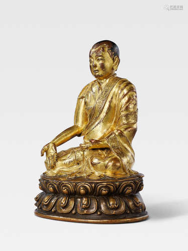 A GILT COPPER ALLOY FIGURE OF THE SIXTH ABBOT OF NGOR MONASTERY, GORAMPA SONAM SENGGE TIBET, 15TH/16TH CENTURY