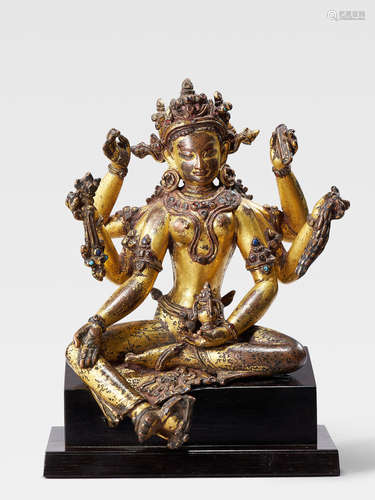 A GILT COPPER FIGURE OF VASUDHARA NEPAL, EARLY MALLA PERIOD, 13TH/14TH CENTURY