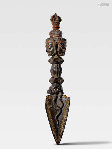 AN EBONY PHURBA TIBET, CIRCA 15TH CENTURY