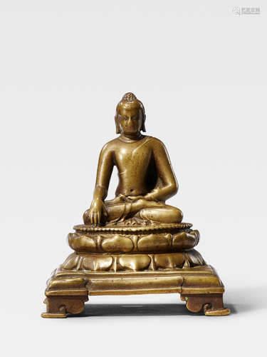 A SILVER AND COPPER INLAID BRASS FIGURE OF SHAKYAMUNI BUDDHA NORTHEASTERN INDIA, PALA PERIOD, 9TH CENTURY