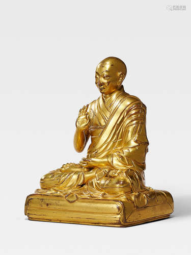 A GILT COPPER ALLOY FIGURE OF THE FIRST PANCHEN LAMA LOBZANG CHOKYI GYELTSEN QING DYNASTY, 17TH/18TH CENTURY