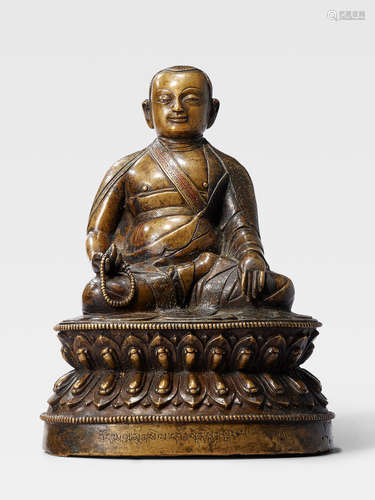 A SILVER AND COPPER INLAID BRASS FIGURE OF BONTON KYERGANGPA CHOKYI SENGGE TIBET, 15TH/16TH CENTURY