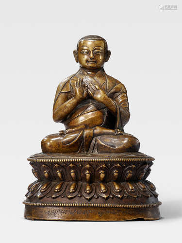 A SILVER AND COPPER INLAID BRASS FIGURE OF NAMKHA GYELTSEN TIBET, 15TH/16TH CENTURY