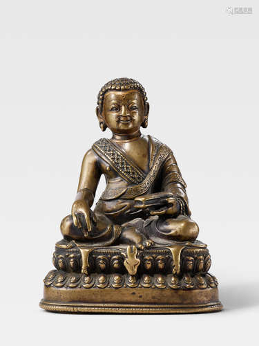 A BRASS FIGURE OF A YOGI TIBET, 16TH CENTURY