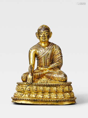 A SILVER INLAID GILT COPPER ALLOY FIGURE OF THE FOUNDER OF THE DRIGUNG KAGYU ORDER, JIGTEN SUMGON RINCHEN PEL TIBET, 13TH/14TH CENTURY