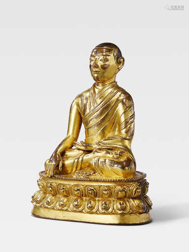 A GILT COPPER ALLOY FIGURE OF A DRIGUNG KAGYU LAMA TIBET, 13TH/14TH CENTURY