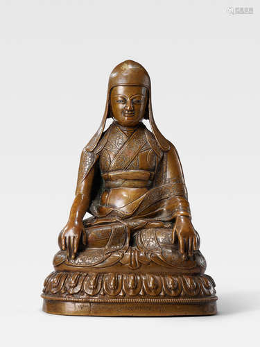 A SILVER INLAID BRASS ALLOY FIGURE OF ZANGPO GYELTSEN TIBET, 15TH/16TH CENTURY