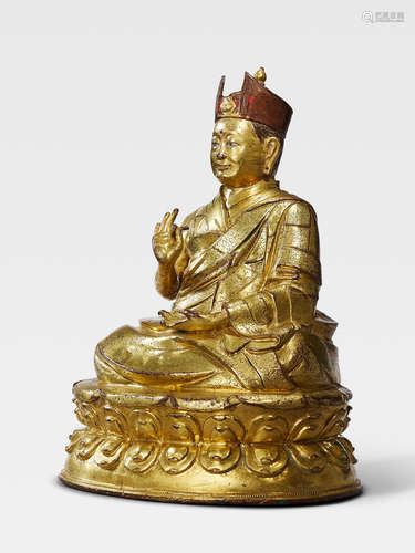 A GILT COPPER ALLOY FIGURE OF THE FOURTH SHAMARPA, CHOKYI DRAKPA YESHE PELZANG TIBET, CIRCA 16TH CENTURY