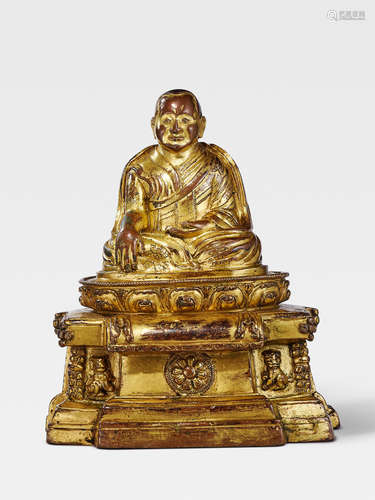 A GILT COPPER ALLOY FIGURE OF LAMA SHANG, FOUNDER OF THE TSELPA KAGYU ORDER TIBET, 13TH/14TH CENTURY