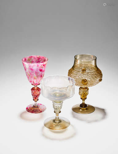 Salviati & C. (founded 1877) Three Lion's-Head Mask Wine Cups circa 1890 opalescent and applied glass with gold leaf each height 7 1/4in (18.5cm); diameter 4in (10cm) height 7 3/4in (19.5cm); diameter 4 3/4in (12cm); height 7 1/4in (18.5cm); diameter 4in (10cm)