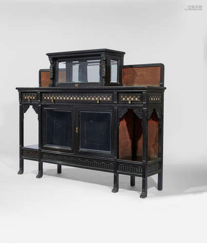 Herter Brothers (1864-1906) Cabinet circa 1880 carved ebonized wood, mother of pearl and brass inlay, bevelled glass, stamped 'HERTER BRO'S' twice on back to reverse, and signed with client's name in pencil height 53in (135cm); width 66in (168cm); depth 15in (38cm)