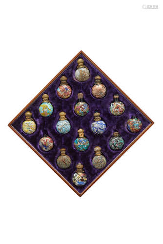 Venetian Collection of Sixteen Scent bottles circa 1870 together with fitted case, including one example with star murrines, one with dove murrines, one with flowers and seven examples with murrines of human faces each length 2 1/2in (6cm); width 1 3/4in (4.5cm)