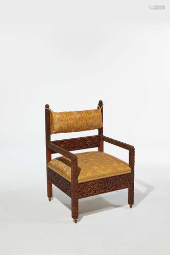 Lockwood de Forest (1850-1932) Armchair circa 1890 teak, on casters, later silk upholstery, carved by the Ahmedabad Wood Carving Company, Ahmedabad, India height 40in (102cm); width 25 1/2in (65cm); depth 24 in (61cm)