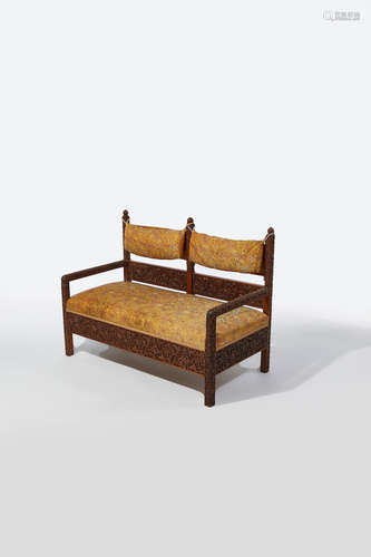 Lockwood de Forest (1850-1932) Sofa circa 1890 teak, on casters, later silk upholstery, carved by the Ahmedabad Wood Carving Company, Ahmedabad, India height 38in (96.5cm); width 50 1/2in (128cm); depth 26in (66cm)