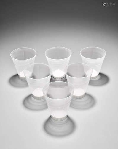 Carlo Scarpa (1906-1978) Set of Eight Mezza Filigrana Water Glasses circa 1940 for Venini, lattimo and mezza-filigrana each height 4in (10cm); diameter 3 3/4in (9.5cm)