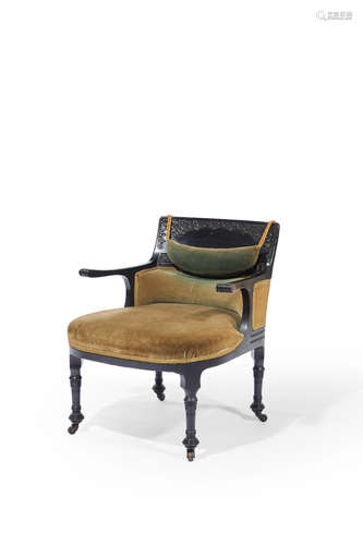 Herter Brothers (1864-1906) Armchair circa 1880 the design attributed to Louis C. Tiffany carved ebonized cherry, olive velvet upholstery, on original brass casters Stamped 5386 on inside of proper right back leg height 31in (79cm); width 27in (68.5cm); depth 26in (66cm)