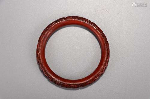 A Chinese Red Lacquerware Bangle With Carving