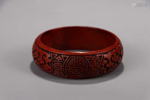 A Chinese Red Lacquerware Bangle With Carving