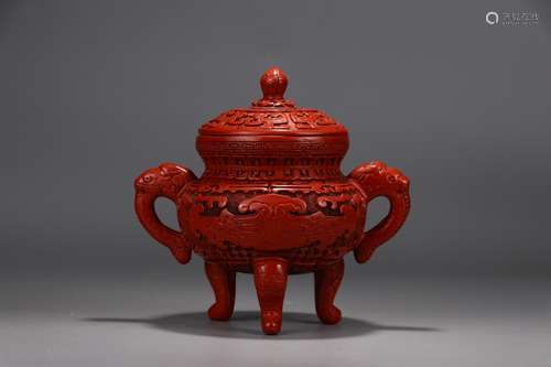 A Chinese Red Lacquerware Tripod Censer With Beast Shaped Ears