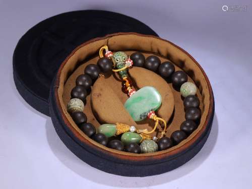 A Chinese Agarwood Bracelet With Jadeite Bead