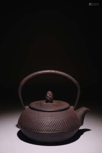 A Chinese Iron Pot With Handle