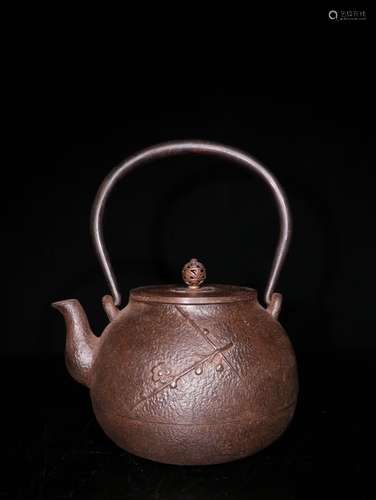 A Chinese Iron Pot With Handle Of Plum Floral Carving