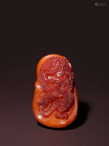 A Chinese Amber Pendant With Dragon Pattern