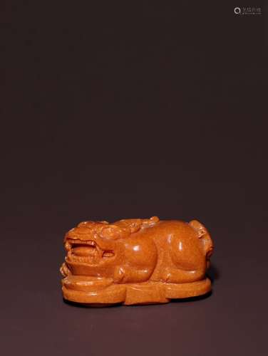 A Chinese Amber Pendant Of Beast Shaping