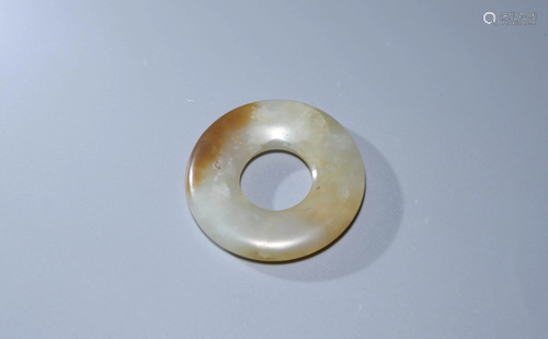 A CHINESE WHITE JADE BI ORNAMENT