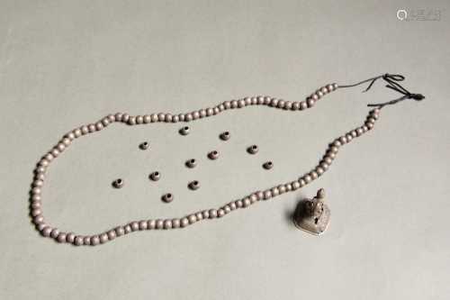 A CHINESE SILVER BEADS STRING