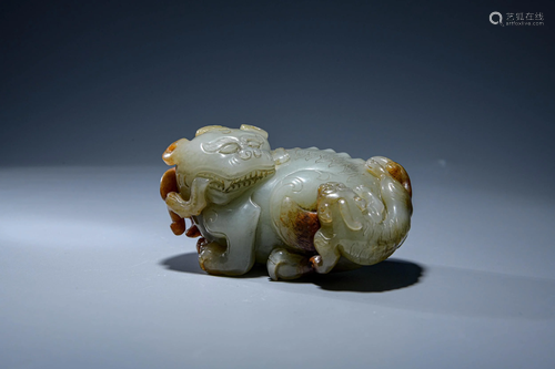 A CHINESE WHITE JADE CARVED BEAST ORNAM…