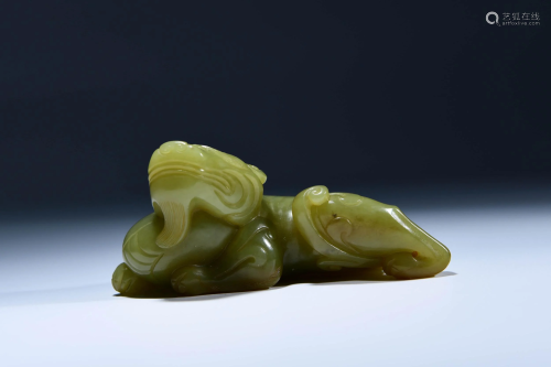 A CHINESE YELLOW JADE CARVED BEAST ORNAM…