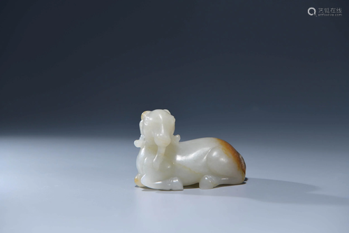 A CHINESE WHITE JADE CARVED SHEEP ORNAM…